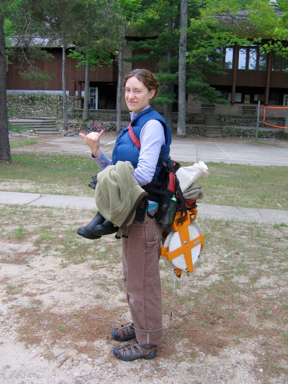 Person holding equipment outside
