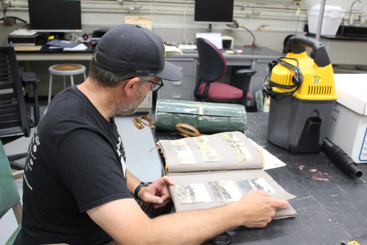 Man looking through a photo album