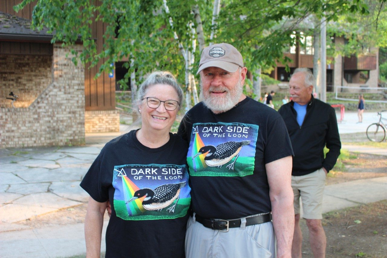 Two people wearing matching shirts