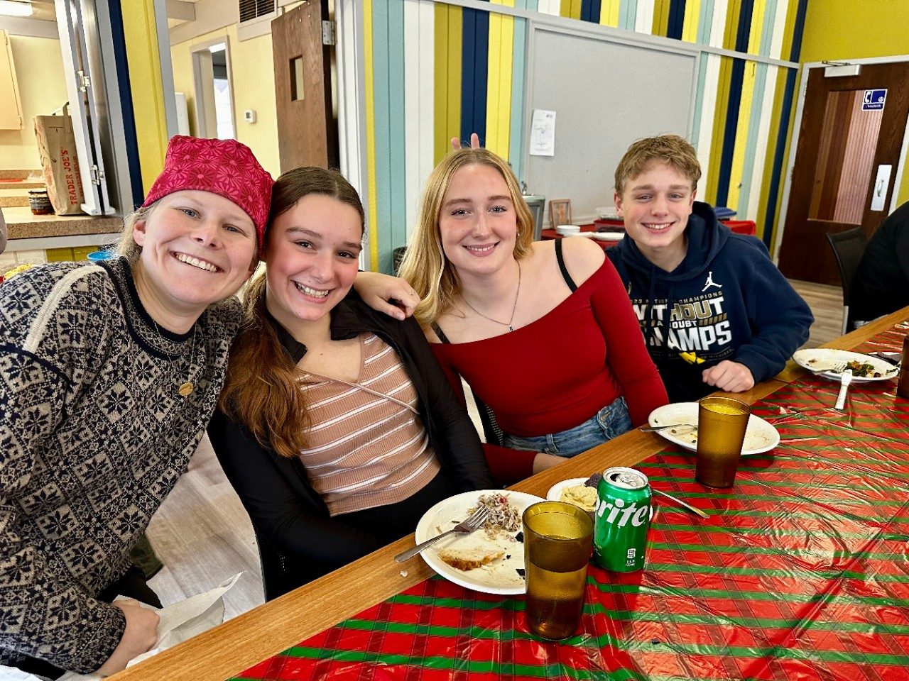 People sitting at a table and eating food