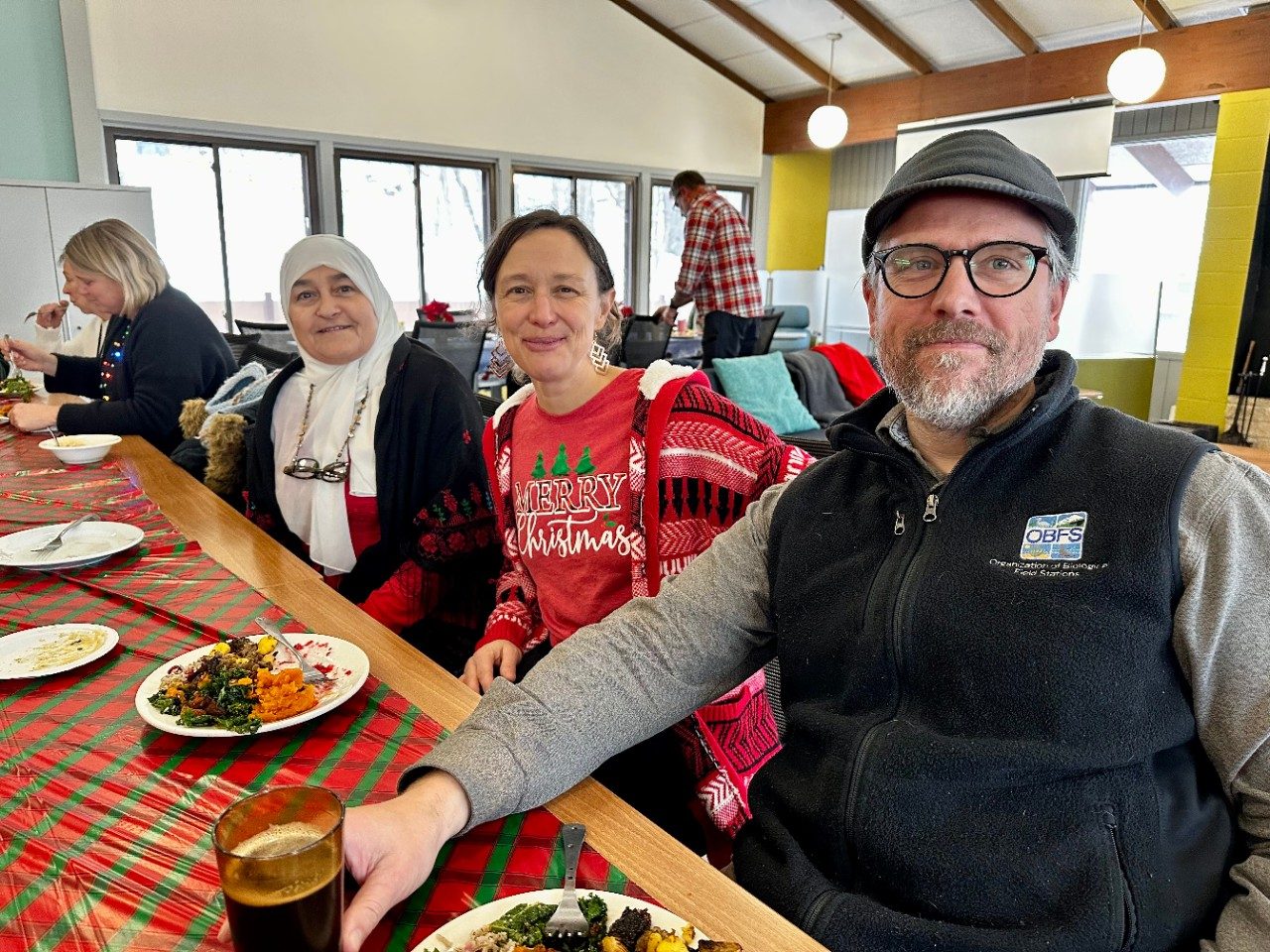 Three people sitting at a table 