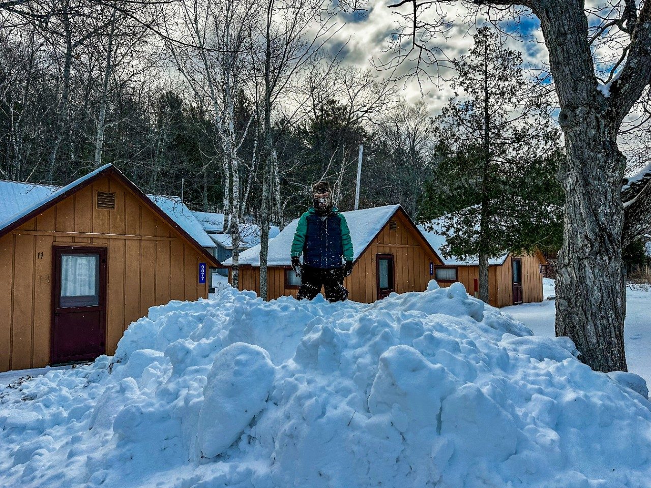 Boy standing on snow pile