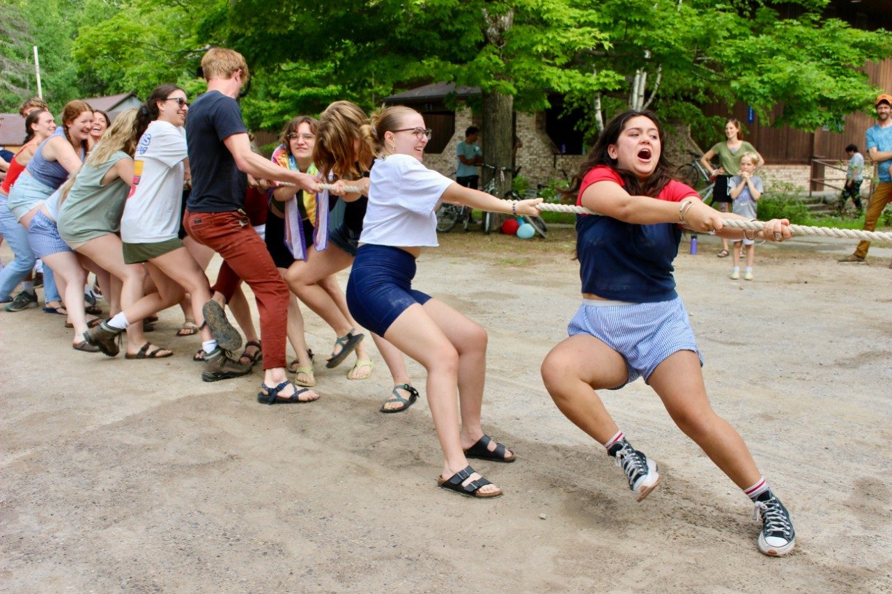 People pulling on rope during game of tug-of-war