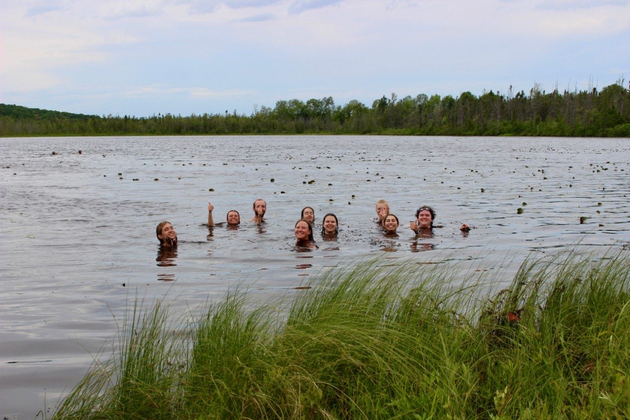 People swimming in lake