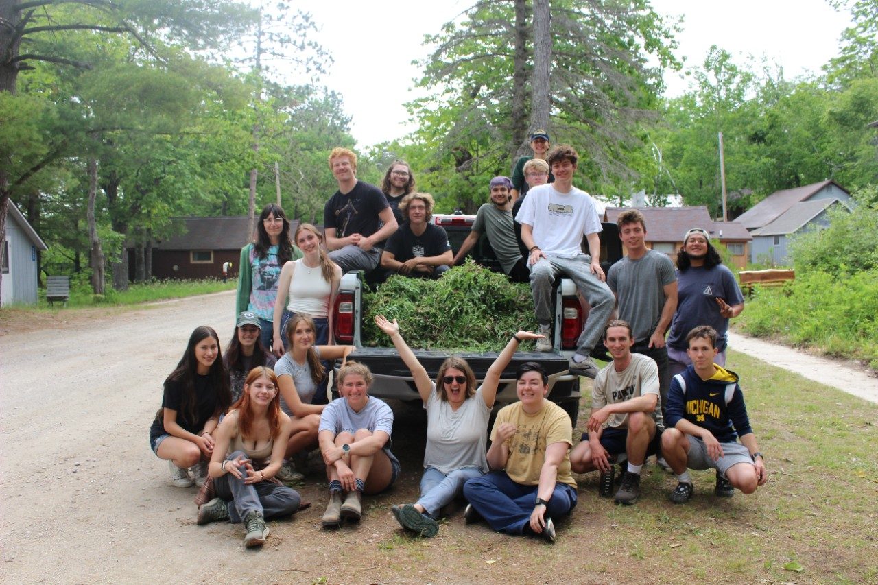 Group picture by a truck