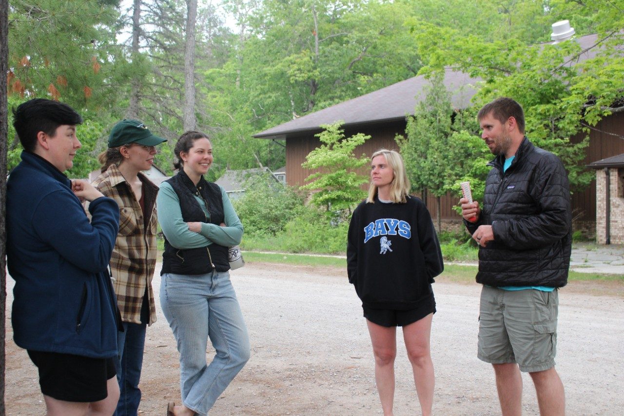 People talking outside in a group