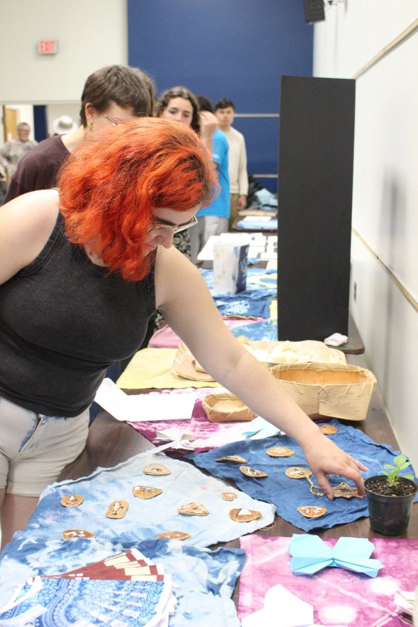 Person looking at items on a table