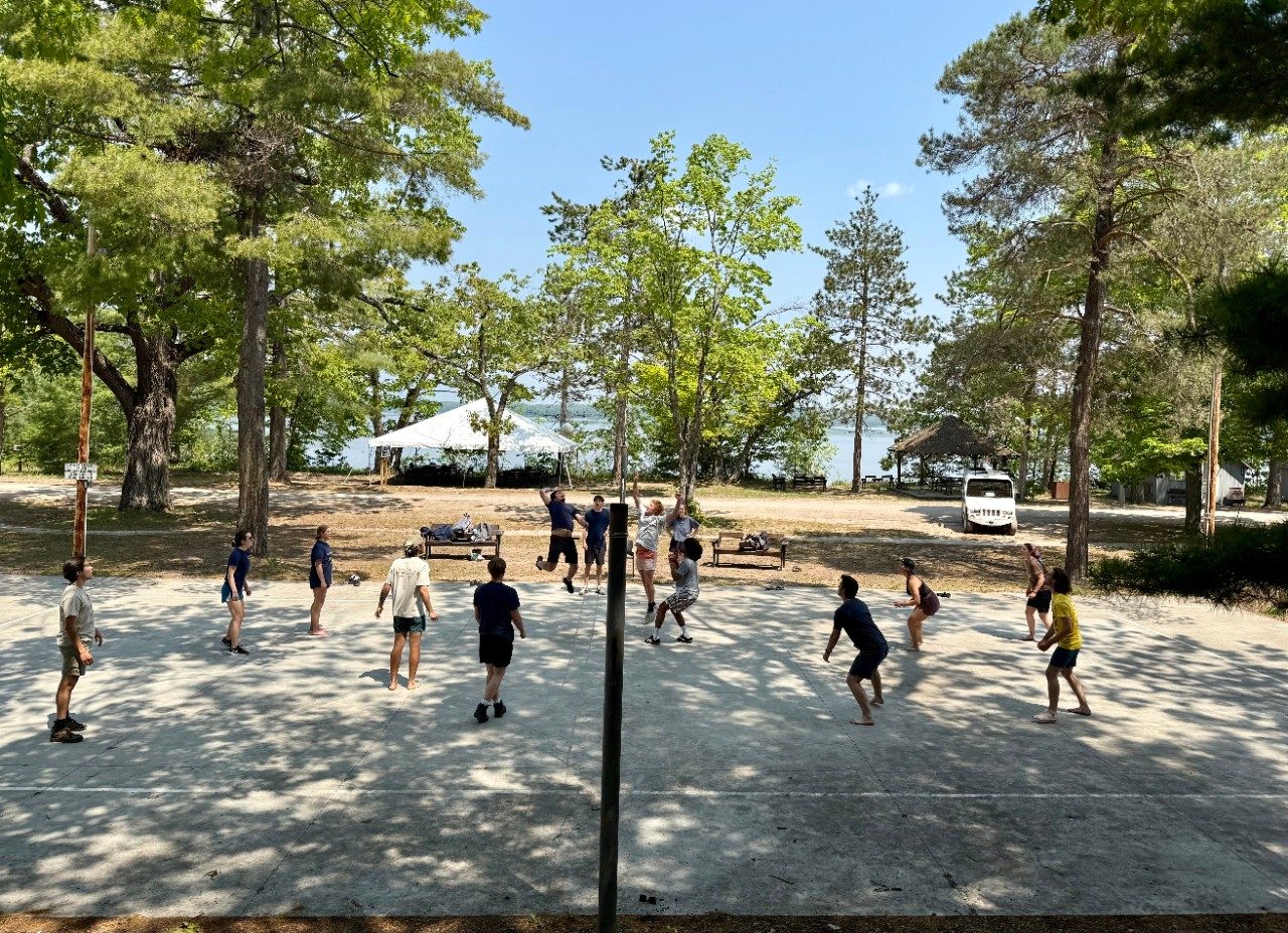 People playing volleyball outside