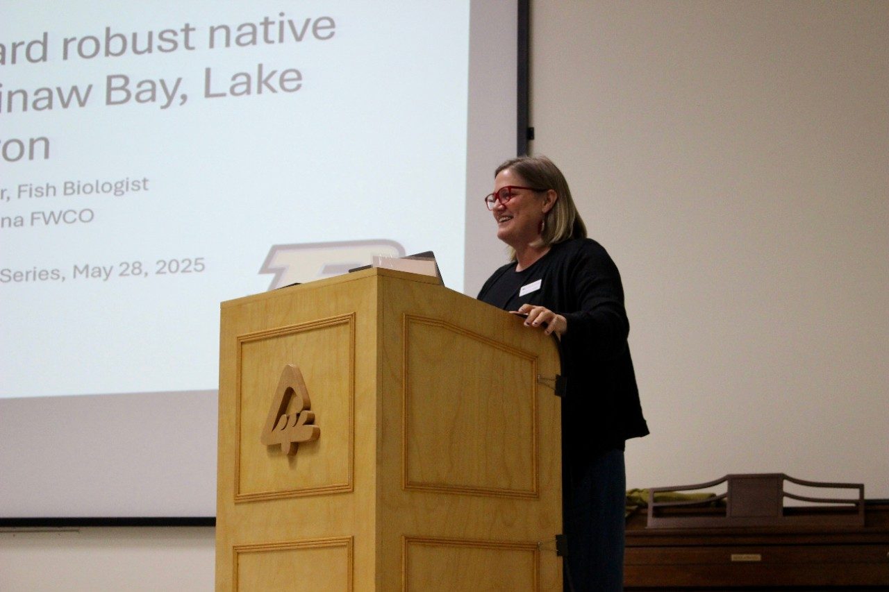 Woman speaking at a podium