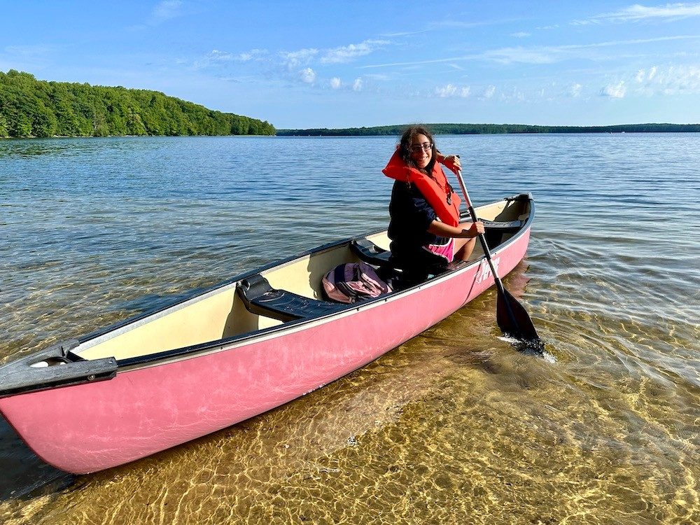 Woman on canoe holding oar