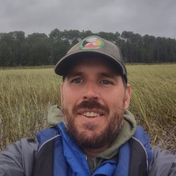 Selfie photo of a man in a marsh