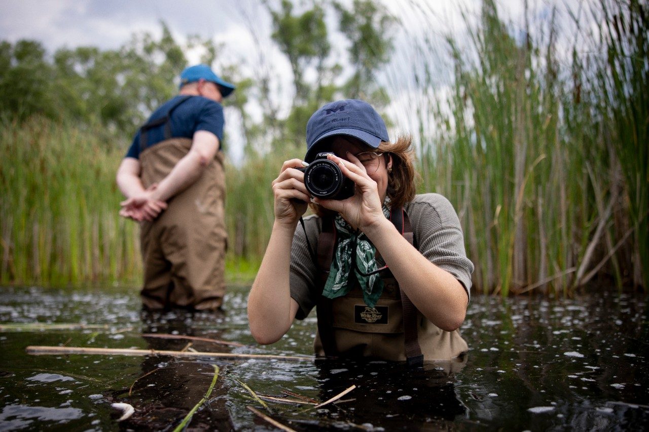 Person in water taking a photo