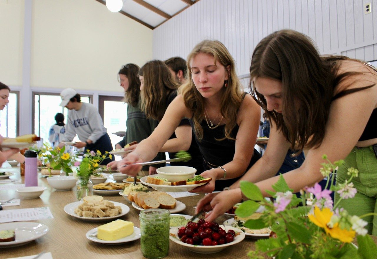 People setting a dinner table