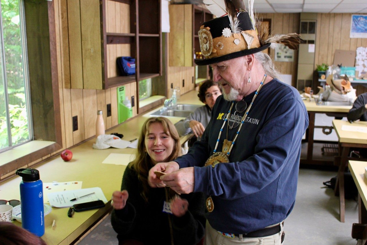 Making birchbark medallions in a classroom