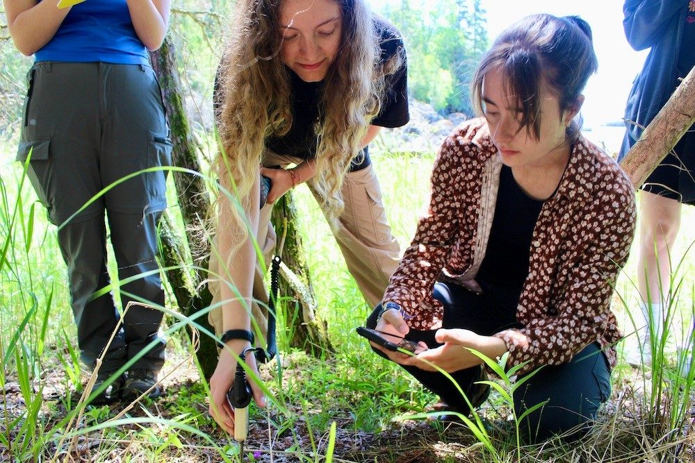 People taking soil sample tests